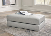 Bay Furniture Gallery - Ashley Furniture - Amiata Living Room - Ottoman / Onyx - 5740514