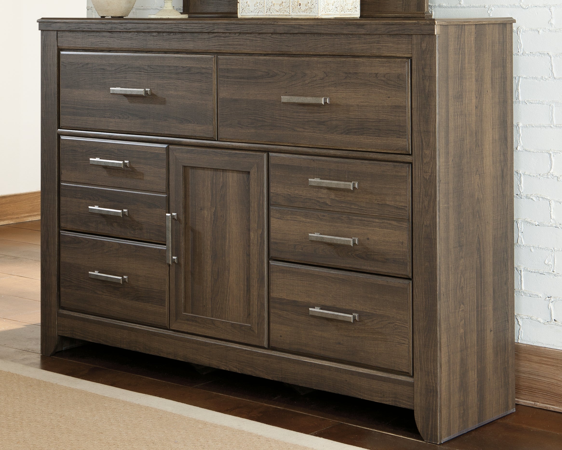 Bay Furniture Gallery - Ashley Furniture - Juararo Bedroom - Five Drawer Chest / Dark Brown - B251-46
