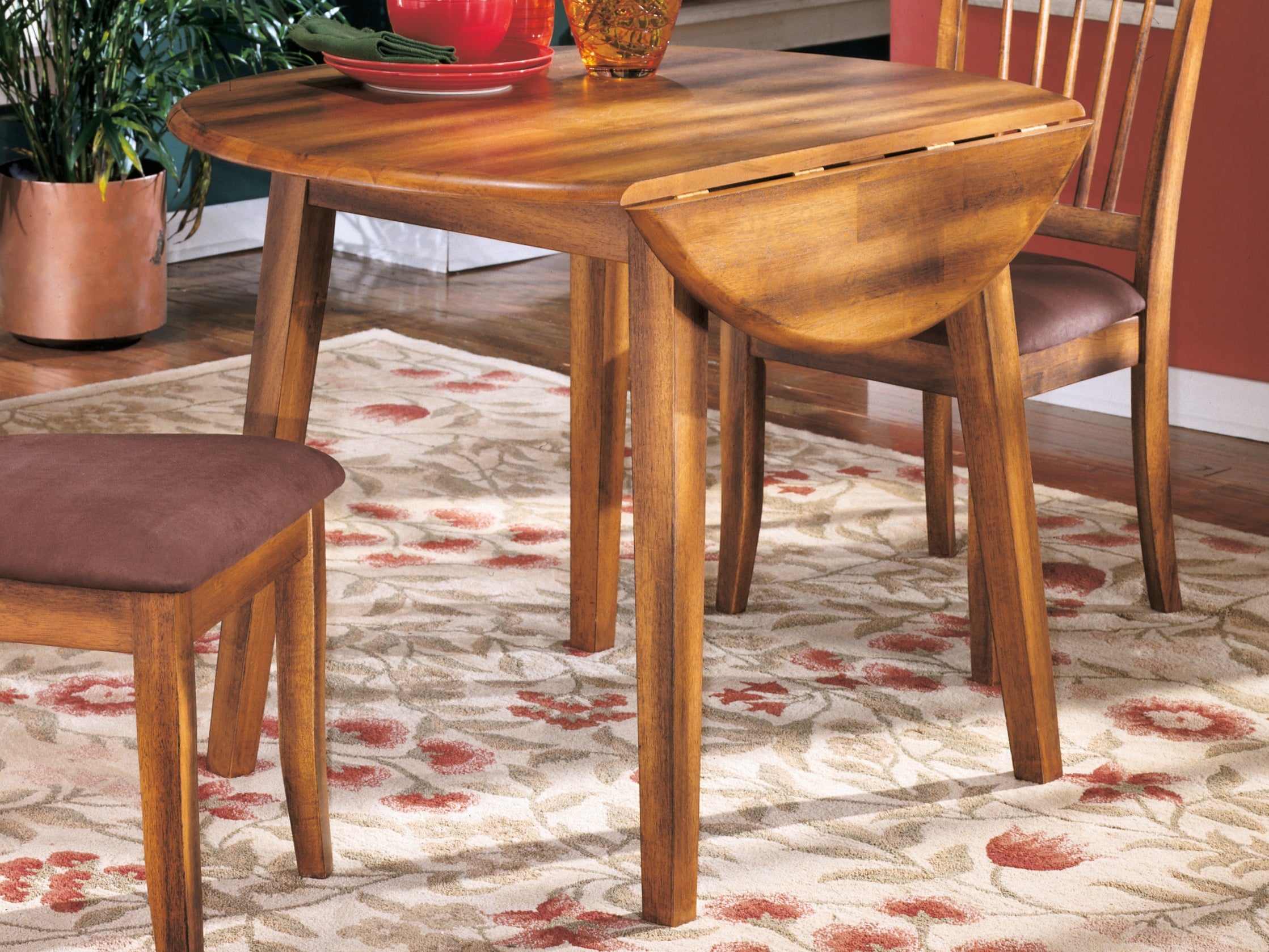 Bay Furniture Gallery - Ashley Furniture - Berringer Dining Room - Round DRM Drop Leaf Table / Rustic Brown - D199-15