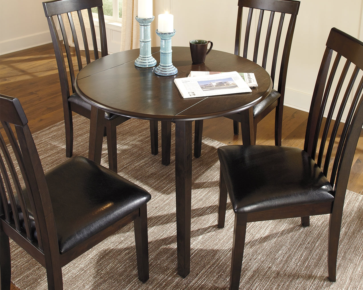 Bay Furniture Gallery - Ashley Furniture - Hammis Dining Room - Round DRM Drop Leaf Table / Dark Brown - D310-15