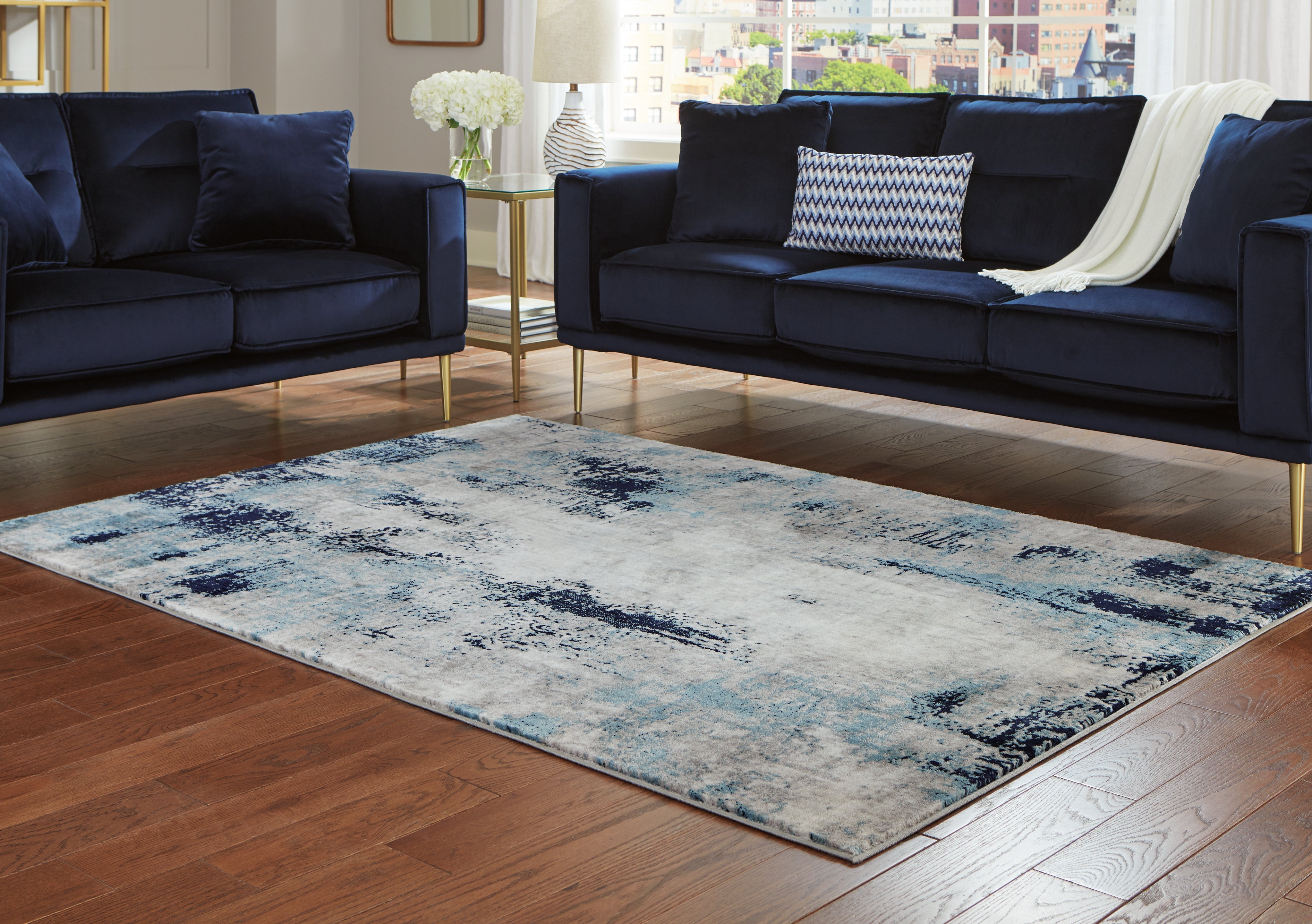 Bay Furniture Gallery - Ashley Furniture - Leonelle Rug - 5'3" x 7'3" Rug / Cream/Blue/Gray - R404872