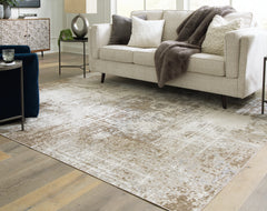 Bay Furniture Gallery - Ashley Furniture - Grifflain Rug - 7'10" x 10'3" Washable Rug / Tan/Brown/Gray - R406231