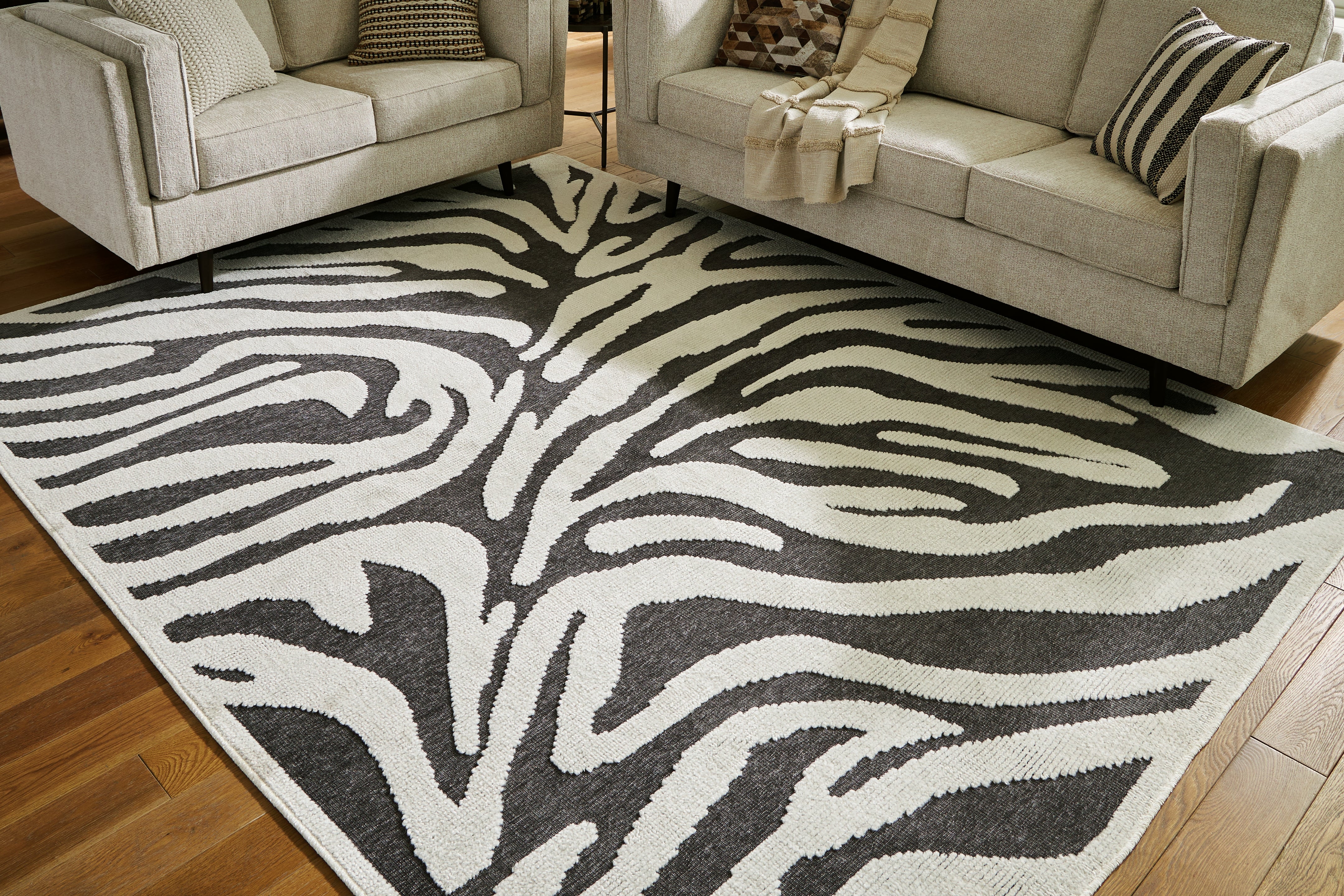 Bay Furniture Gallery - Ashley Furniture - Thomwith Rug - 8' x 10'2" Washable Rug / Black/Ivory - R406291