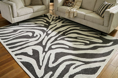 Bay Furniture Gallery - Ashley Furniture - Thomwith Rug - 8' x 10'2" Washable Rug / Black/Ivory - R406291