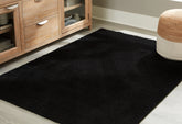 Bay Furniture Gallery - Ashley Furniture - Anaben Rug - 5' x 7' Washable Rug / Black - R406312
