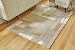 Bay Furniture Gallery - Ashley Furniture - Abbotton Rug - 5' x 7' Rug / Taupe/Gray/Caramel - R406332