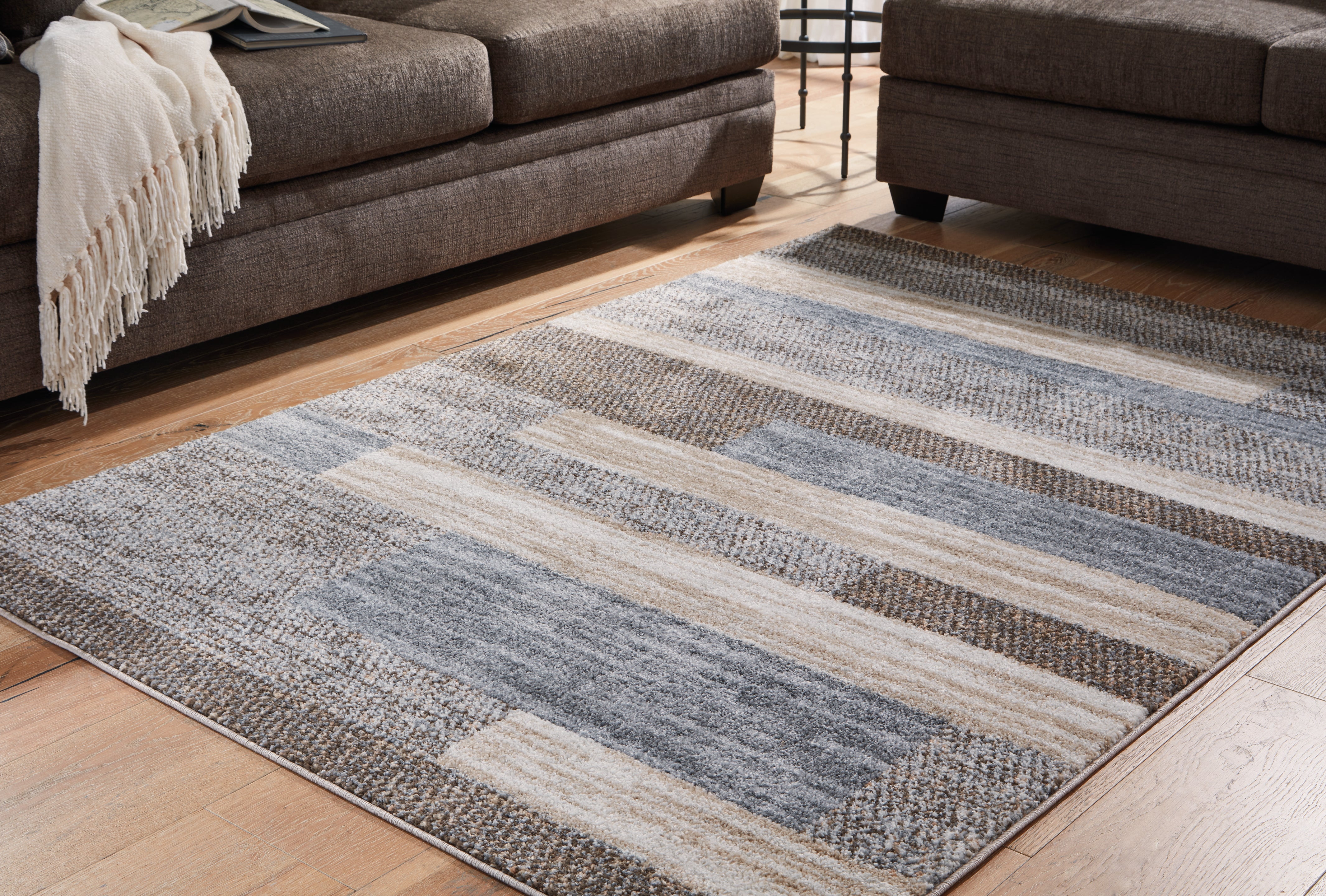 Bay Furniture Gallery - Ashley Furniture - Sethburn Rug - 5' x 7' Rug / Cream/Brown/Gray - R406592
