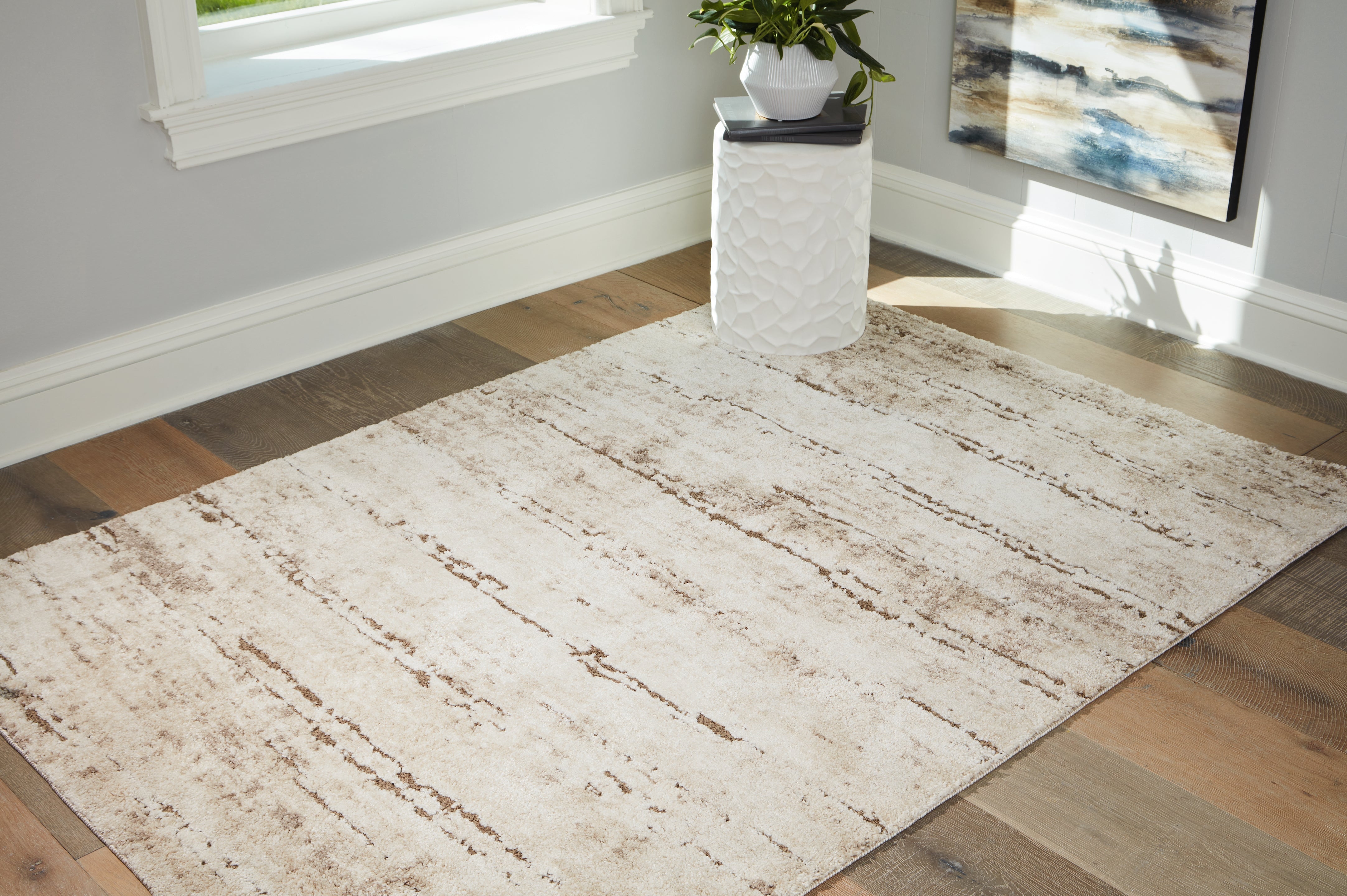 Bay Furniture Gallery - Ashley Furniture - Kasney Rug - 5' x 7' Rug / Cream/Brown - R406852