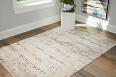 Bay Furniture Gallery - Ashley Furniture - Kasney Rug - 5' x 7' Rug / Cream/Brown - R406852