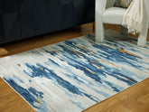Bay Furniture Gallery - Ashley Furniture - Vinlett Rug - 5' x 7' Washable Rug / Cream/Blue/Brown - R407042