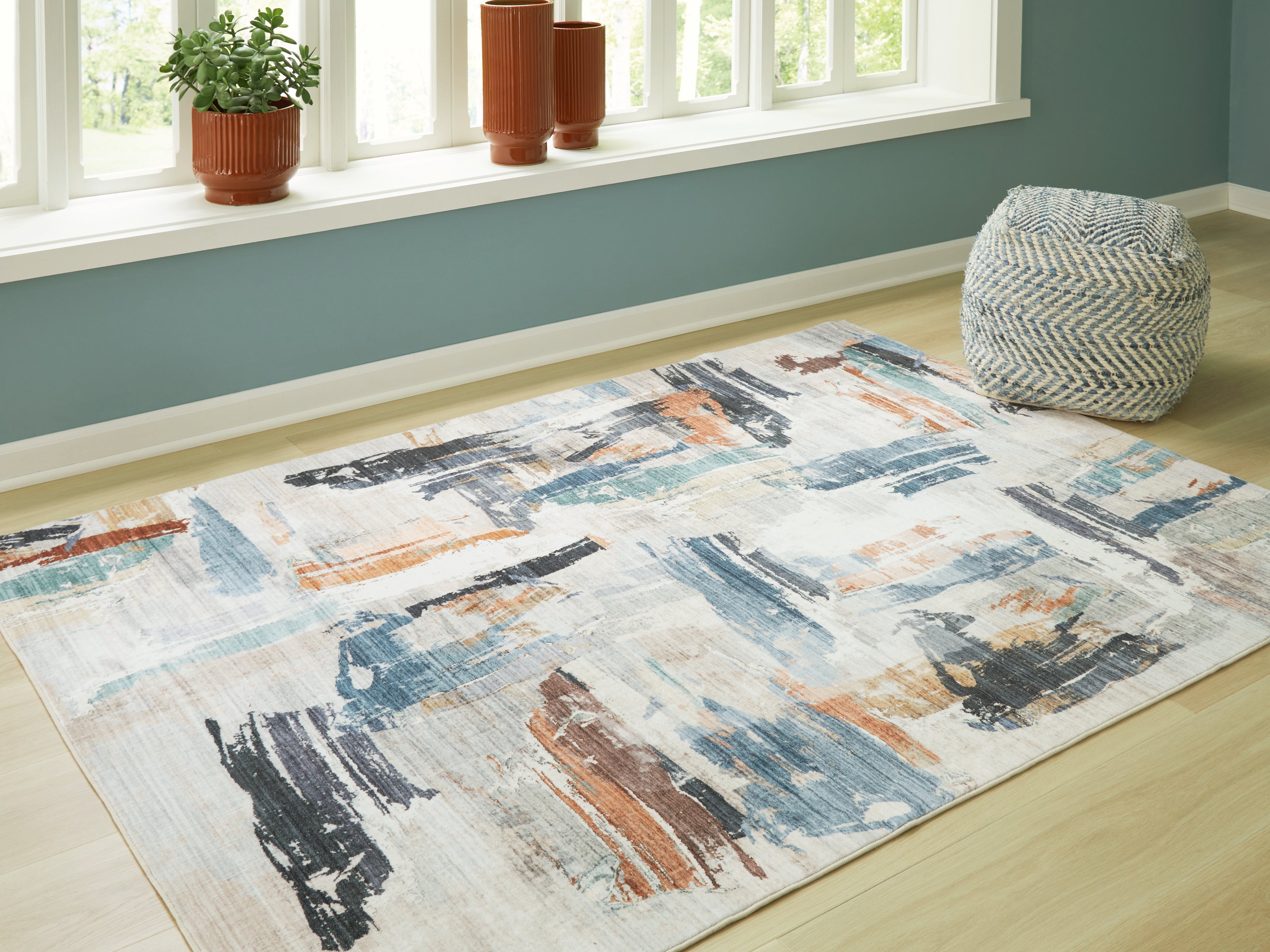 Bay Furniture Gallery - Ashley Furniture - Hessland Rug - 8' x 10' Washable Rug / Multi - R407051