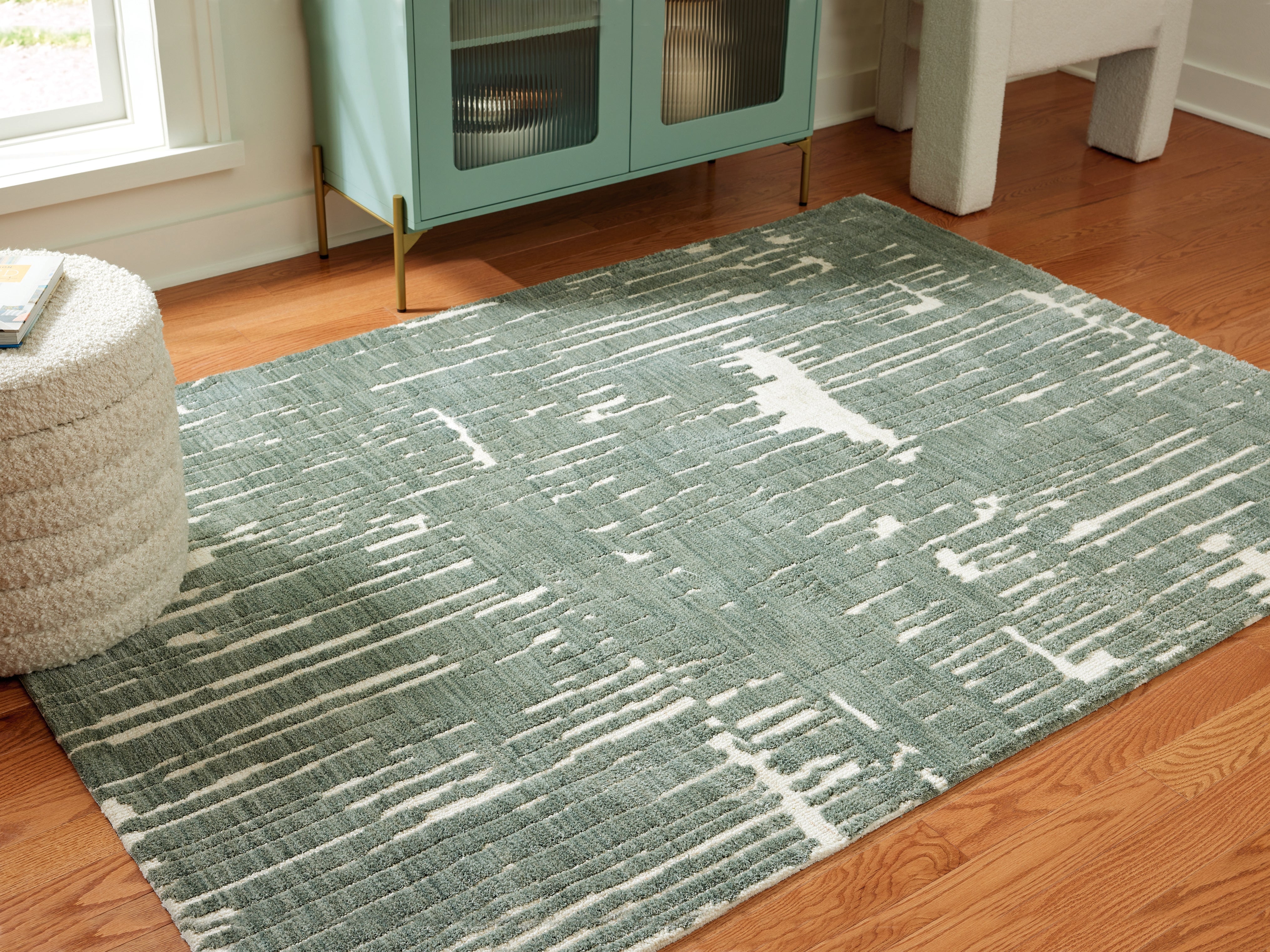 Bay Furniture Gallery - Ashley Furniture - Cayworth Rug - 5' x 7' Rug / Teal/White - R407092
