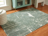 Bay Furniture Gallery - Ashley Furniture - Cayworth Rug - 5' x 7' Rug / Teal/White - R407092
