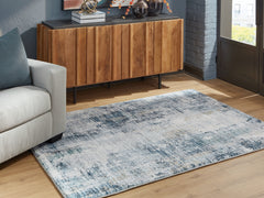 Bay Furniture Gallery - Ashley Furniture - Arlenmont Rug - 7'6" x 9'6" Area Rug / Blue/White/Brown - R407481