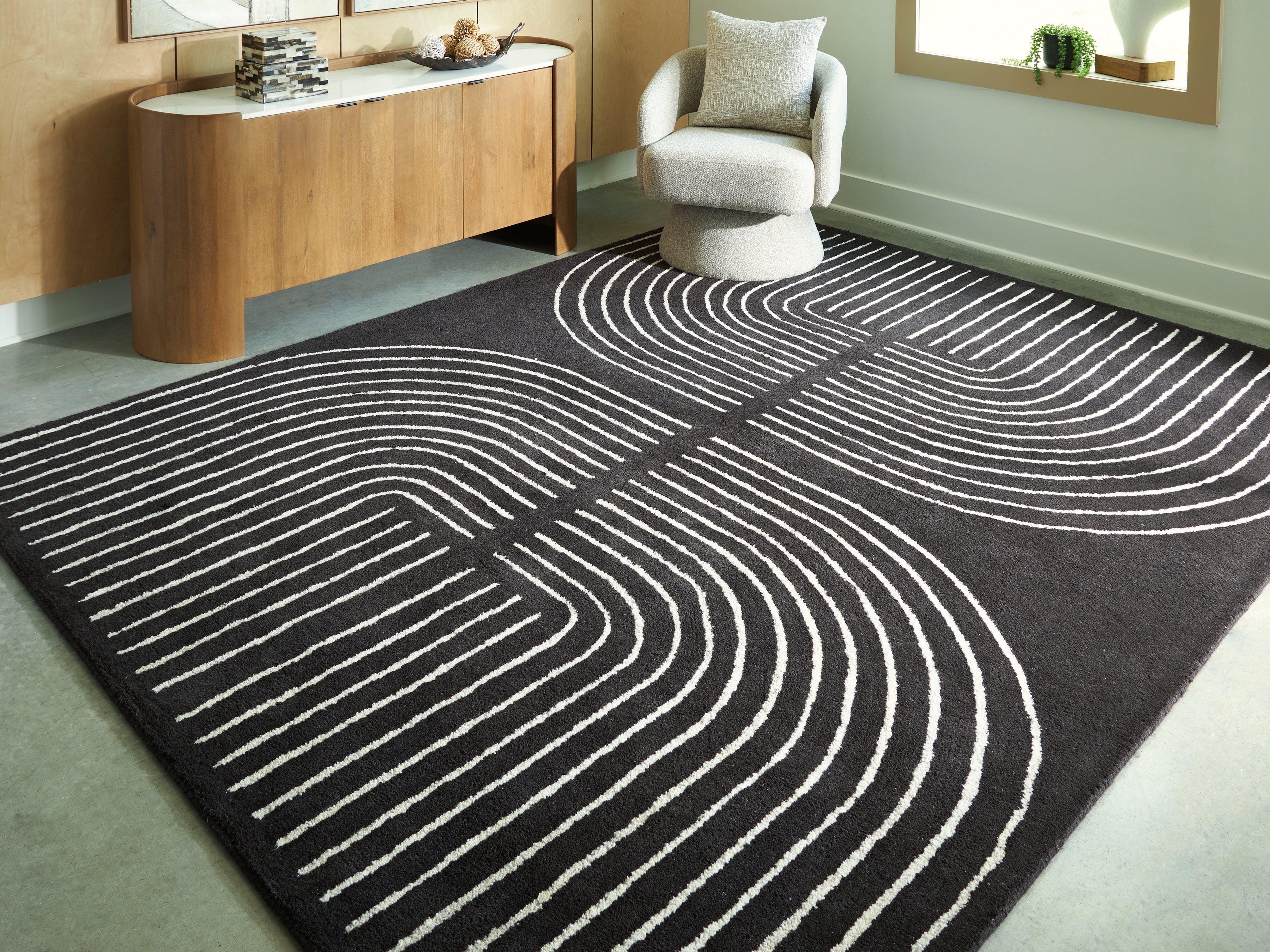 Bay Furniture Gallery - Ashley Furniture - Eldonmore Rug - 5' x 7' Area Rug / Black/Ivory - R407572