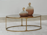 Bay Furniture Gallery - Ashley Furniture - Korajane Coffee Table - Oval Cocktail Table / Antique Gold - T399-0
