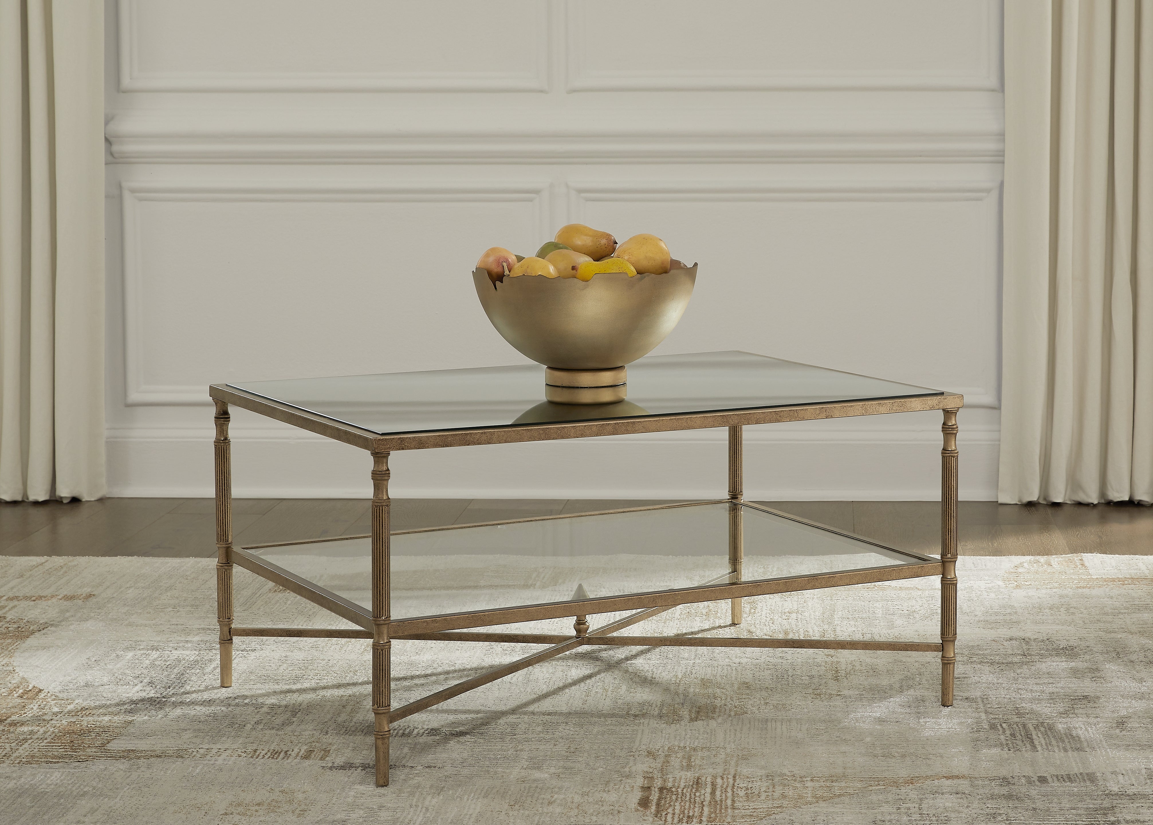 Bay Furniture Gallery - Ashley Furniture - Cloverty Coffee Table - Rectangular Cocktail Table / Aged Gold Finish - T440-1