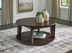 Bay Furniture Gallery - Ashley Furniture - Korestone 2 Coffee Table - Round Cocktail Table / Dark Brown - T657-8