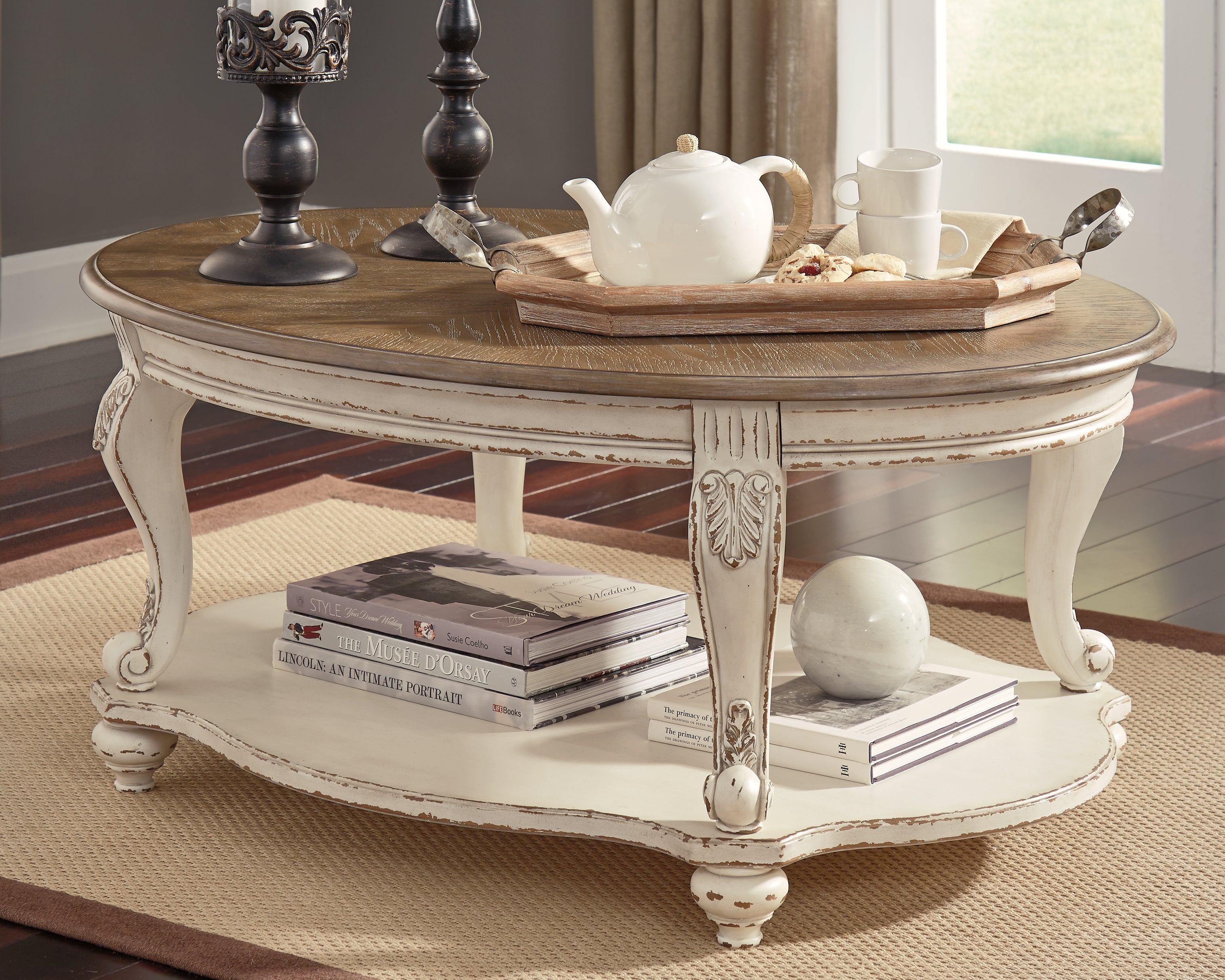 Bay Furniture Gallery - Ashley Furniture - Realyn Coffee Table - Oval Cocktail Table / White/Brown - T743-0