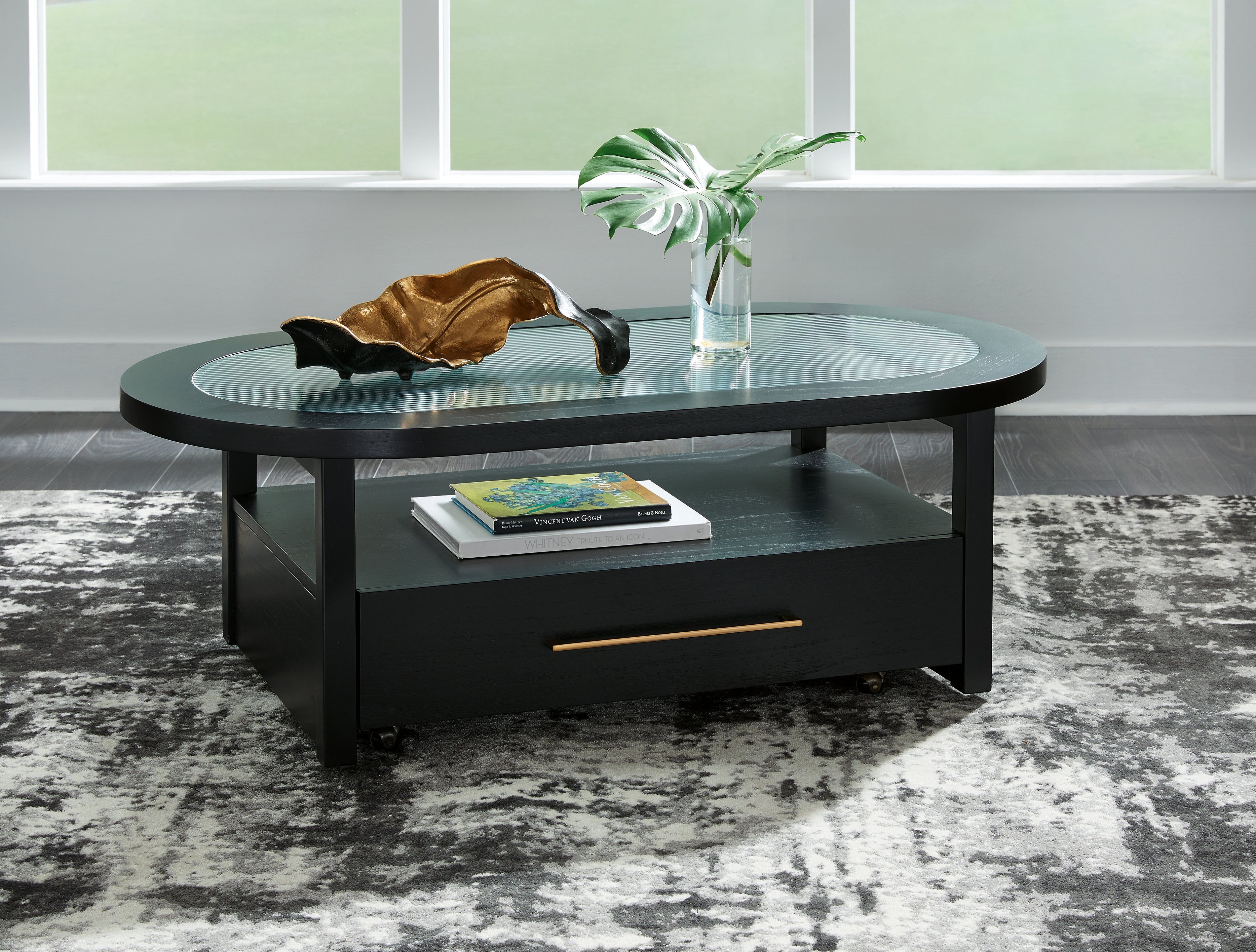 Bay Furniture Gallery - Ashley Furniture - Winbardi Coffee Table - Oval Cocktail Table / Black - T786-0