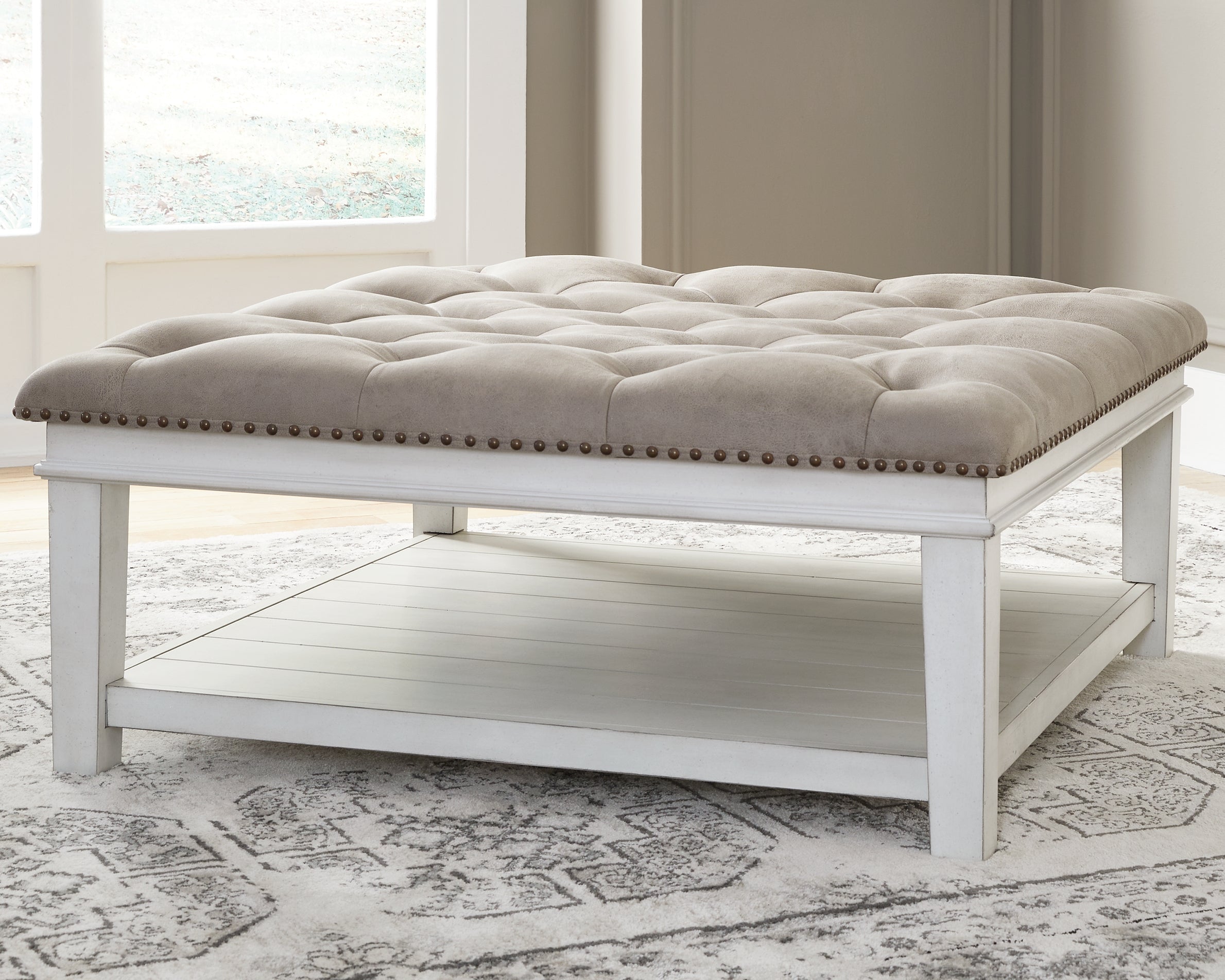 Bay Furniture Gallery - Ashley Furniture - Kanwyn Upholstered Ottoman Coffee Table - UPH Ottoman Cocktail Table / Whitewash - T937-21