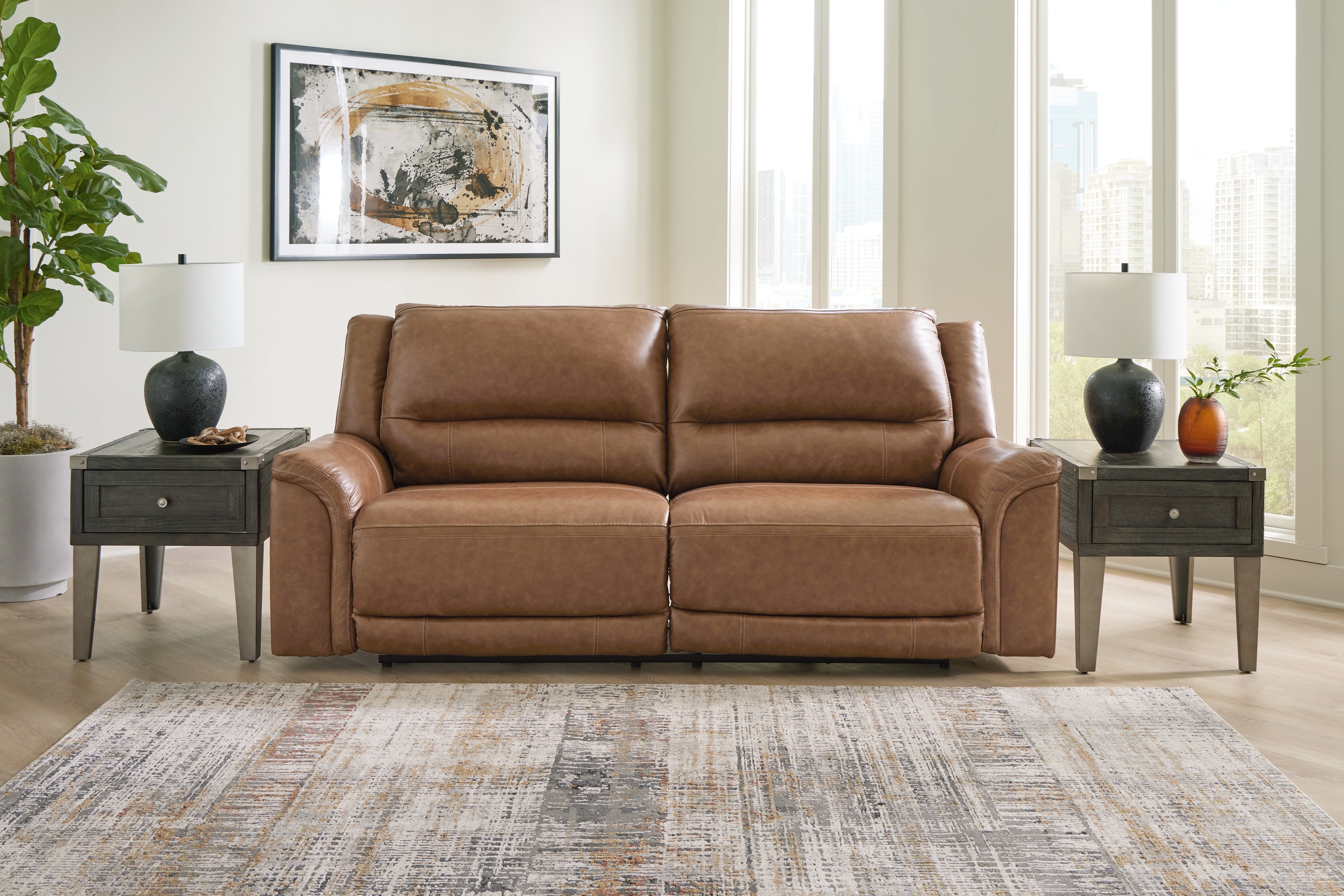 Bay Furniture Gallery - Ashley Furniture - Trasimeno Living Room - 2 Seat PWR REC Sofa ADJ HDREST / Caramel - U8281547