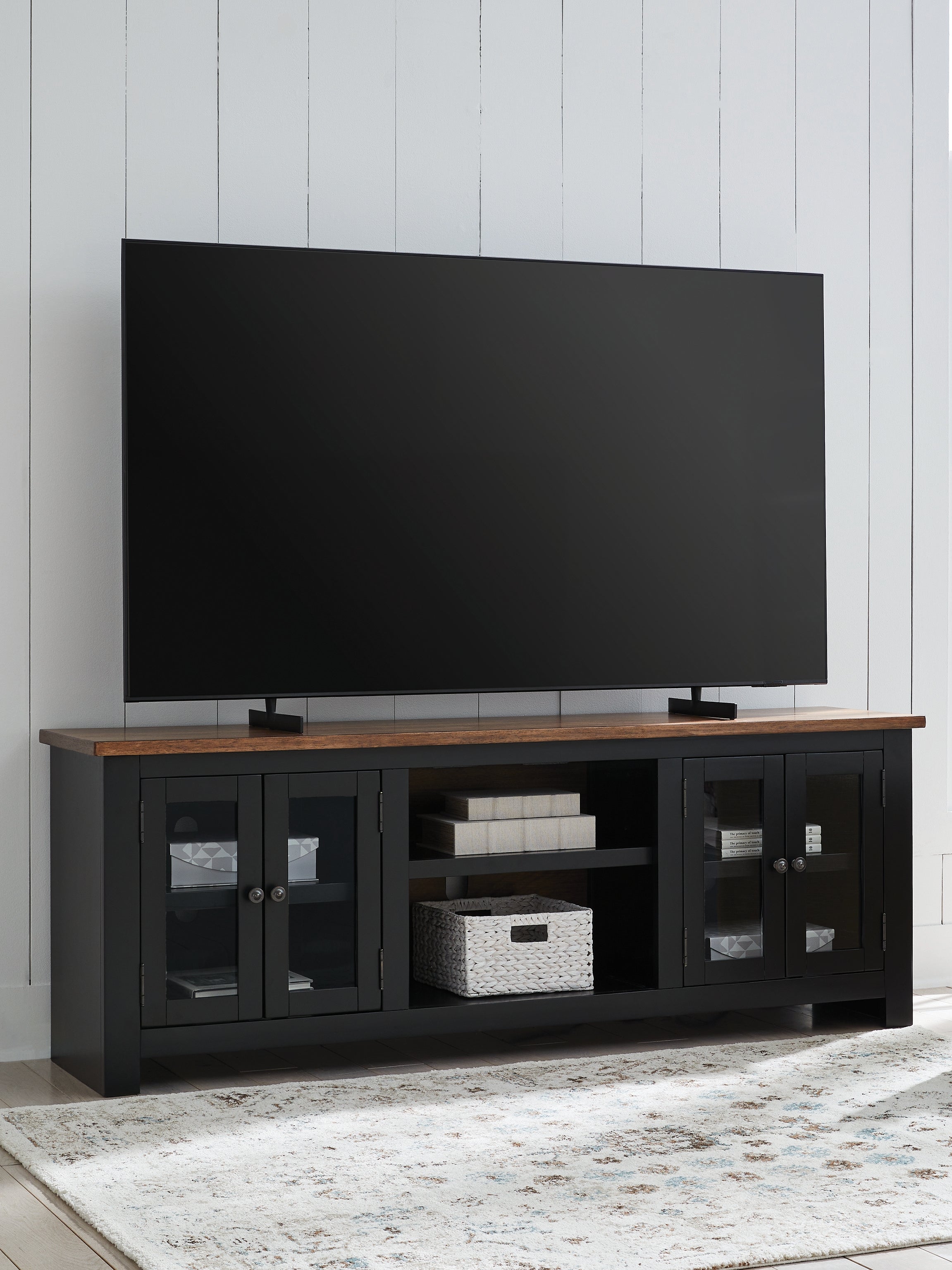 Bay Furniture Gallery - Ashley Furniture - Wildenauer 76" TV Stand - 76" / Brown/Black - W664-68