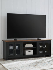 Bay Furniture Gallery - Ashley Furniture - Wildenauer 76" TV Stand - 76" / Brown/Black - W664-68