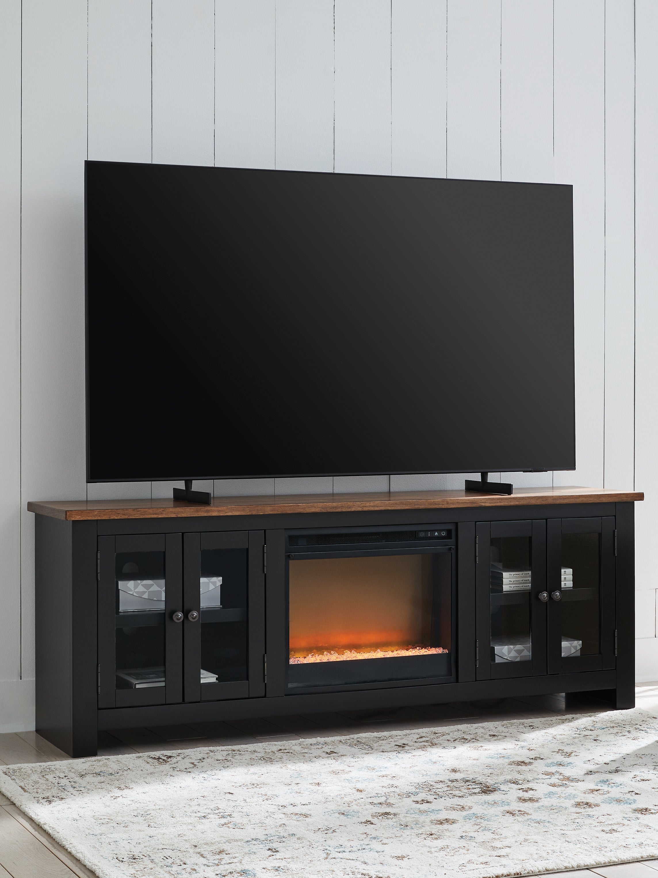 Bay Furniture Gallery - Ashley Furniture - Wildenauer 76" TV Stand with Electric Fireplace - 76" TV Stand with Electric Fireplace / Brown/Black - W664W2