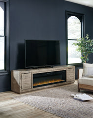Bay Furniture Gallery - Ashley Furniture - Krystanza TV Stand with Electric Fireplace - TV Stand with Electric Fireplace / Weathered Gray - W760W1