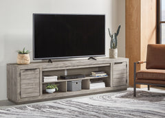 Bay Furniture Gallery - Ashley Furniture - Naydell 92" TV Stand - 92" / Gray - W996-78