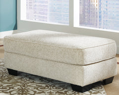 Bay Furniture Gallery - Ashley Furniture - Monaghan Living Room - Ottoman / Sandstone - 9620514