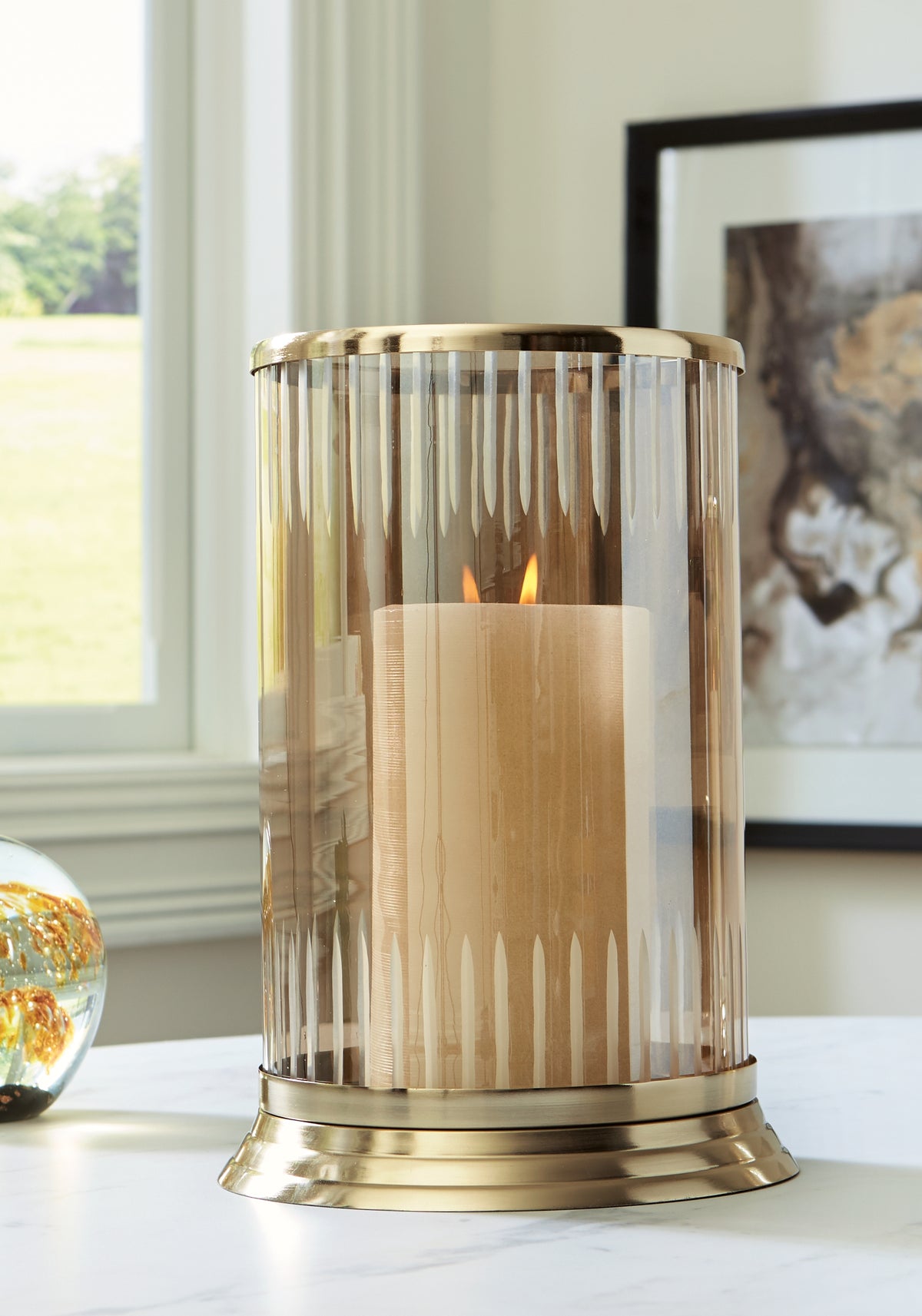 Bay Furniture Gallery - Ashley Furniture - Aavinson Candle Holder - Candle Holder / Amber/Gold Finish - A2000688