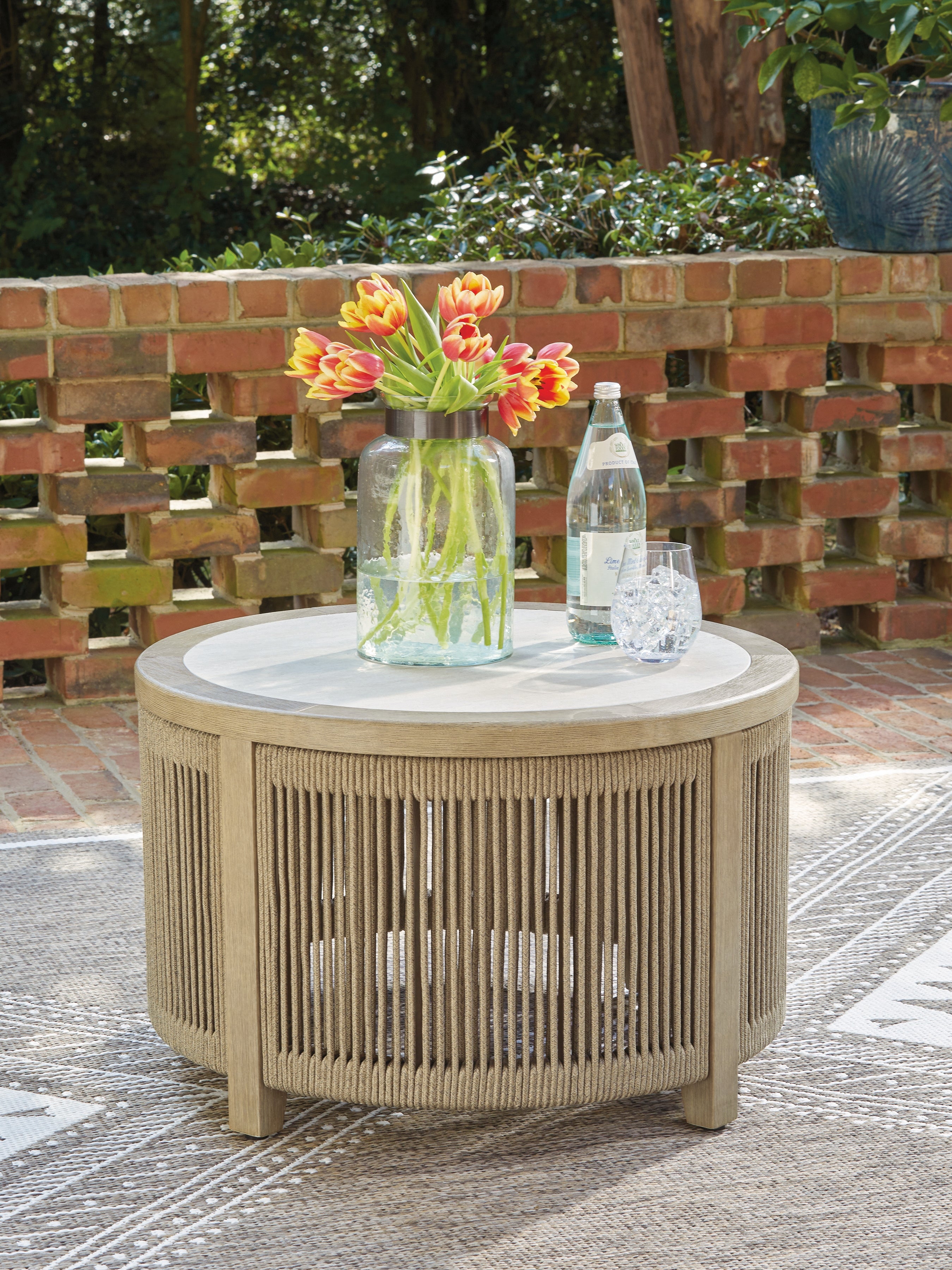 Bay Furniture Gallery - Ashley Furniture - Spooners Cove Outdoor - Round Cocktail Table / Beige - PCP469-708