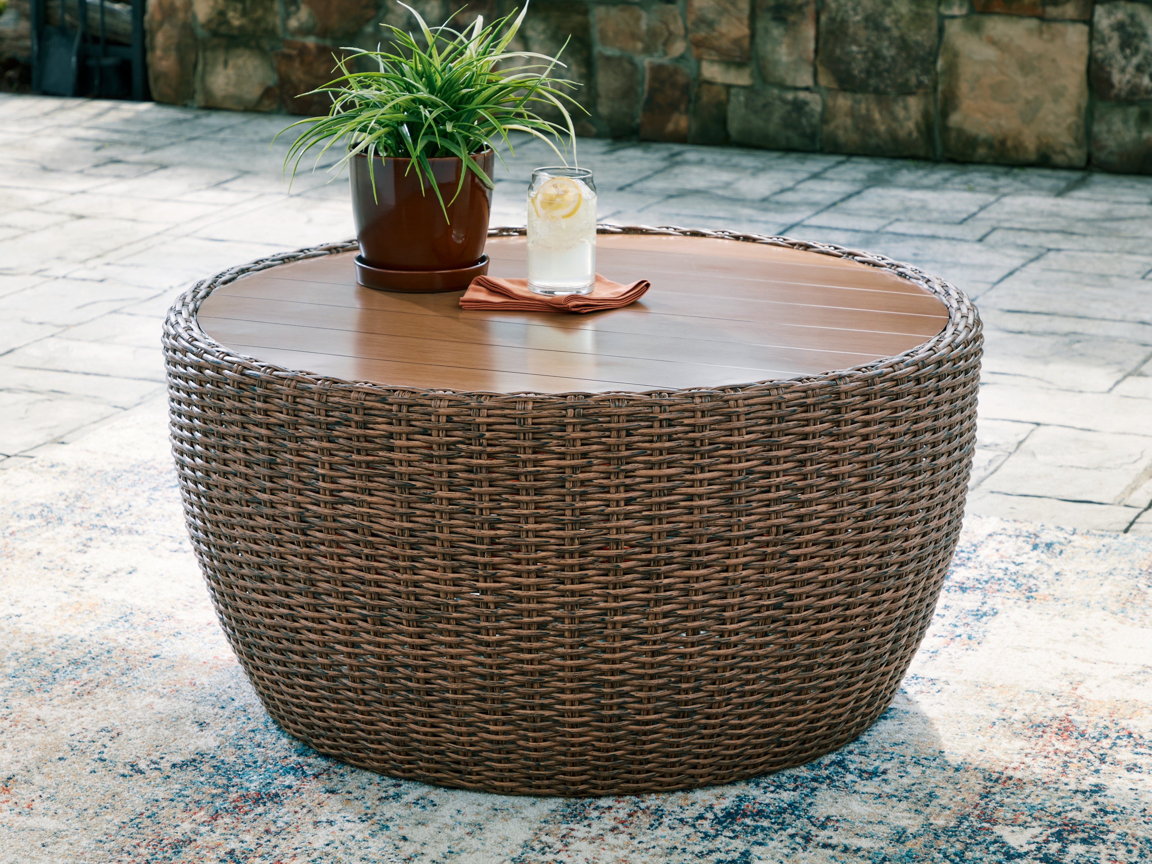 Bay Furniture Gallery - Ashley Furniture - Double Point Outdoor - Round Cocktail Table / Beige - PCP503-708