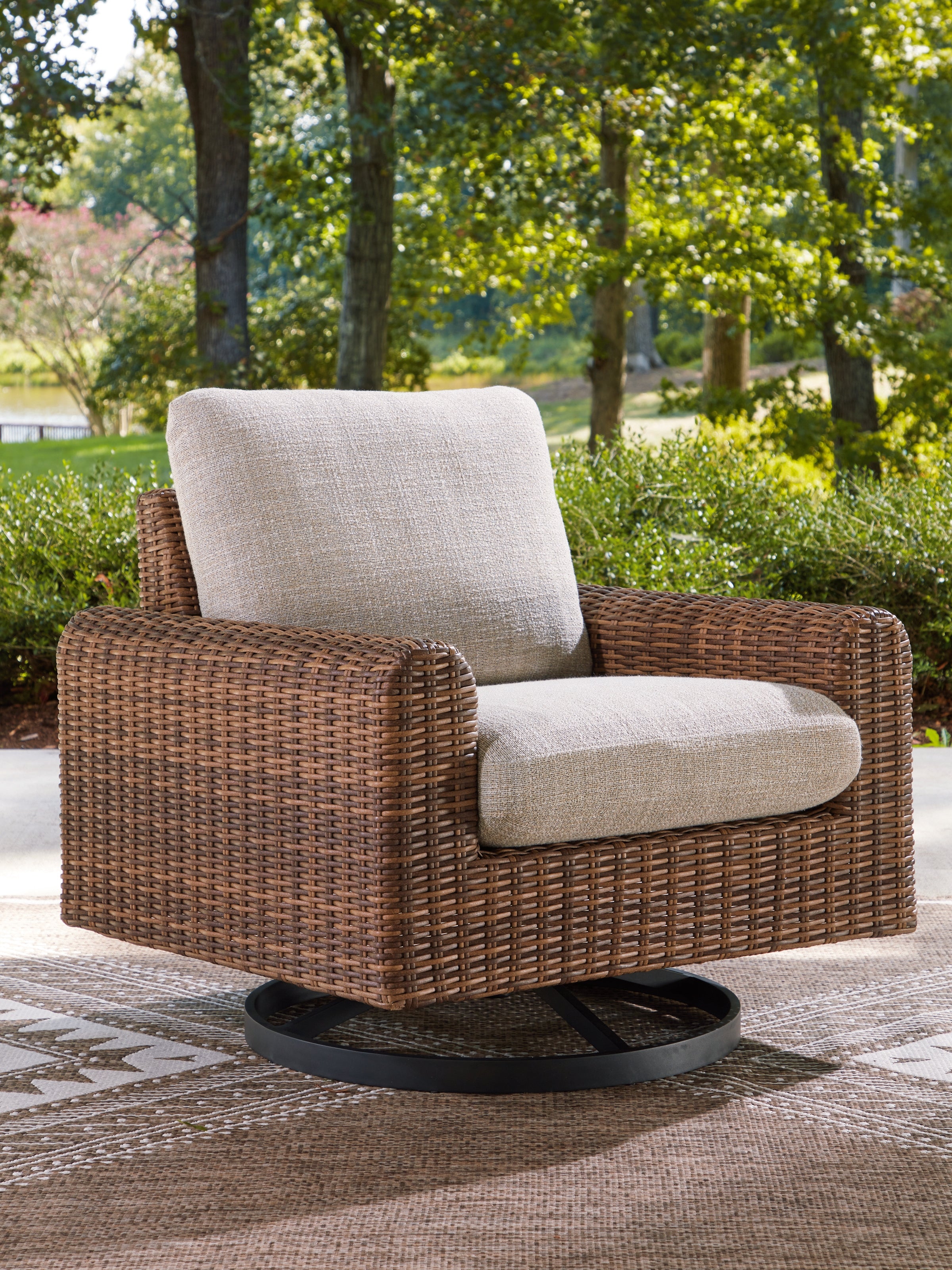 Bay Furniture Gallery - Ashley Furniture - Dolan Creek Outdoor - Swivel Lounge w/ Cushion / Gray/Brown - PCP610-821
