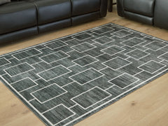 Bay Furniture Gallery - Ashley Furniture - Elderland Rug - Washable 5' x 7' Area Rug / Black/Gray - R407402