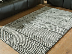 Bay Furniture Gallery - Ashley Furniture - Kurtmen Rug - 5' x 7' Area Rug / Black/Ivory - R407592