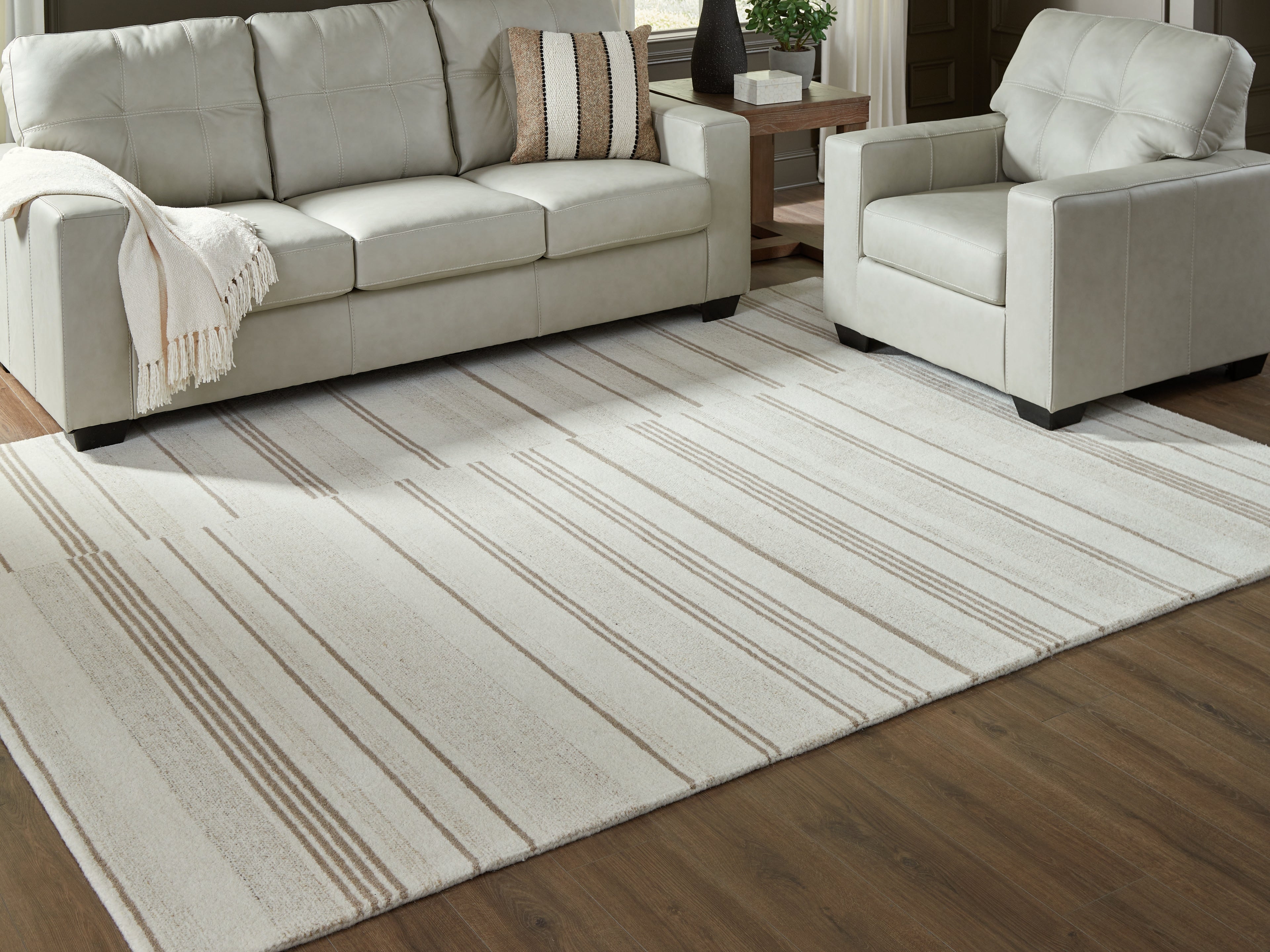 Bay Furniture Gallery - Ashley Furniture - Gadence Rug - 5' x 7' Area Rug / Ivory/Tan - R407642