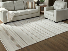Bay Furniture Gallery - Ashley Furniture - Gadence Rug - 5' x 7' Area Rug / Ivory/Tan - R407642