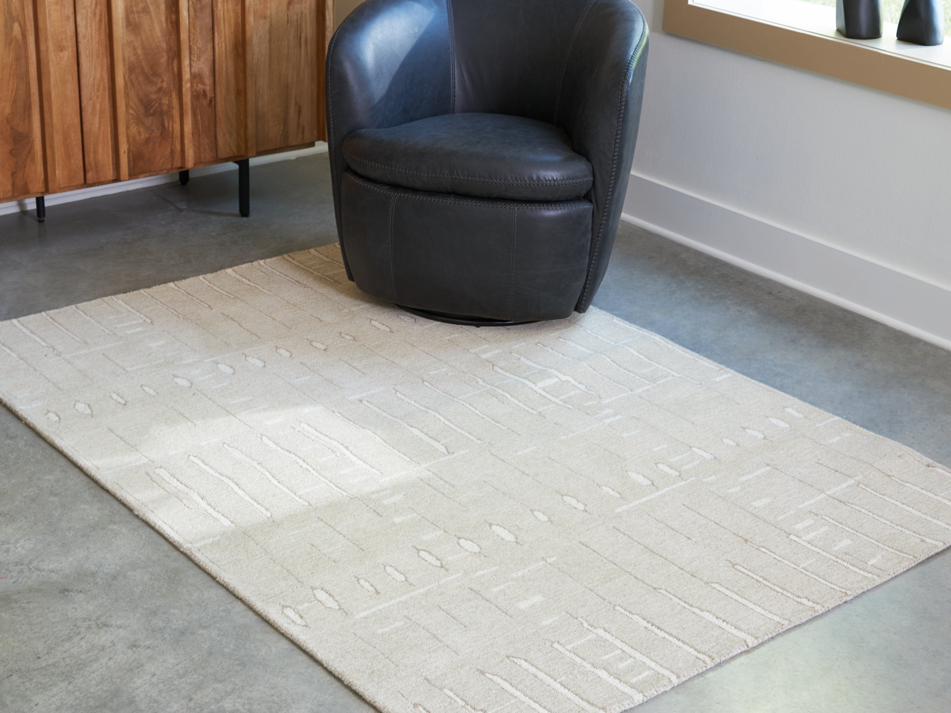 Bay Furniture Gallery - Ashley Furniture - Wolbert Rug - 7'8" x 10' Area Rug / Tan/Ivory - R407661