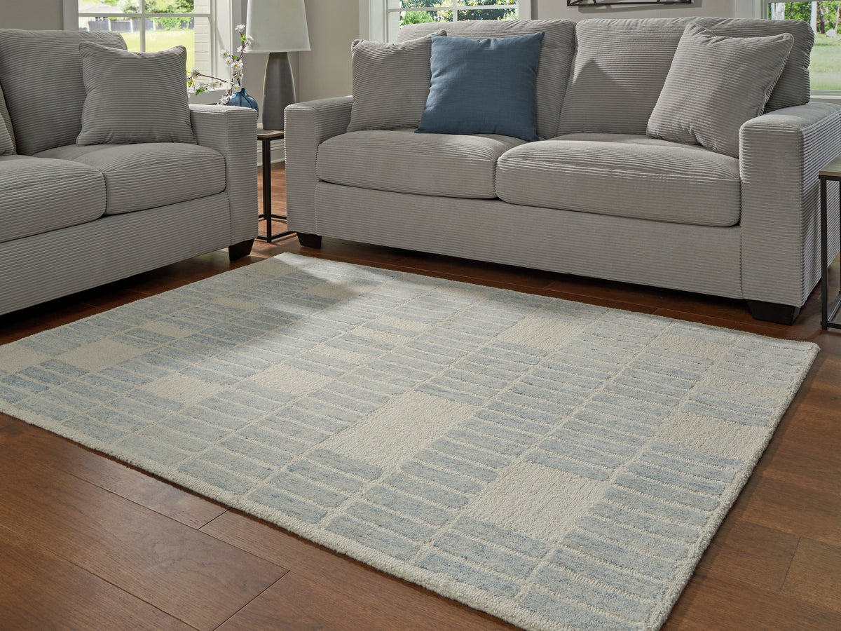 Bay Furniture Gallery - Ashley Furniture - Dylanton Rug - 5' x 7' Area Rug / Ivory/Blue - R407812