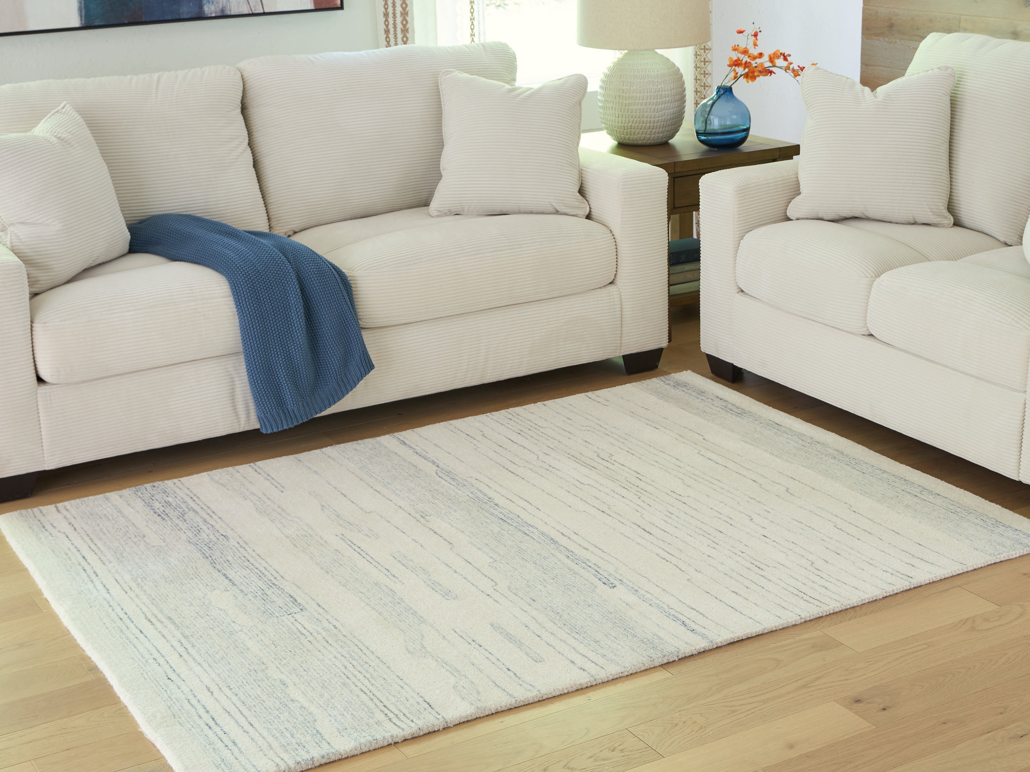 Bay Furniture Gallery - Ashley Furniture - Genemost Rug - 7'8" x 10' Area Rug / Ivory/Blue - R407841